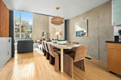 a kitchen and dining room with a table and chairs at Gaslamp Row House - Sleeps 8 Private Garage AC in San Diego