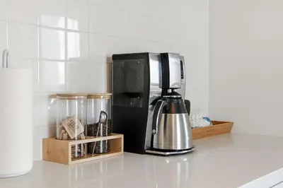 a kitchen counter with a coffee maker and a coffeemaker at Oceanview Mission Beach Compound, Balcony, Patio, Fire Pit, BBQ, Steps to Sand in San Diego
