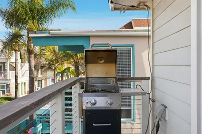a grill on the balcony of a house at Oceanview Mission Beach Compound, Balcony, Patio, Fire Pit, BBQ, Steps to Sand in San Diego