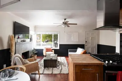 a kitchen and living room with a stove and a living room at SoCal Living w/ Pool, hot tub and movie theater in San Diego