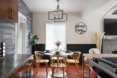 a dining room with a table and chairs in a kitchen at SoCal Living w/ Pool, hot tub and movie theater in San Diego