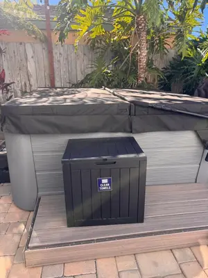 a box sitting on the ground under a table at Point Loma Hideaway Relaxing Hot Tub & AC in San Diego