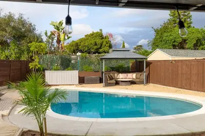 a swimming pool in a yard with a gazebo at San Diego Private Pool Oasis Modern 3BR 2BA in San Diego