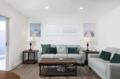 a living room with two couches and a coffee table at San Diego Private Pool Oasis Modern 3BR 2BA in San Diego