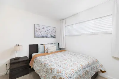 a white bedroom with a bed and a window at San Diego Private Pool Oasis Modern 3BR 2BA in San Diego