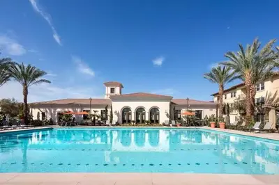 a large swimming pool in front of a building at Stylish 2BR Foothill Escape in Irvine in Lake Forest