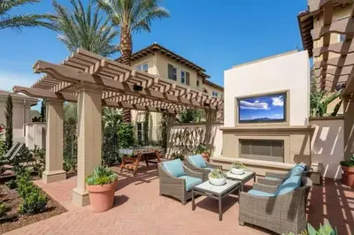 a patio with chairs and a wooden pergola at Stylish 2BR Foothill Escape in Irvine in Lake Forest