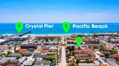 a city with green descriptions of a beach at Coastal Villas Walk to the Beach 3 Homes Villa in San Diego