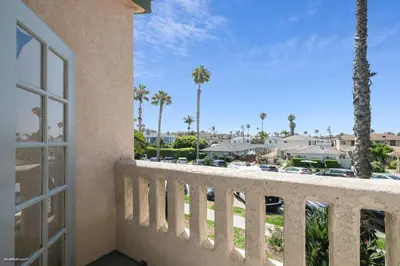 a balcony with a view of a resort at Coastal Villas Walk to the Beach 3 Homes Villa in San Diego