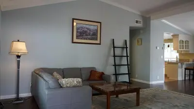 a living room with a couch and a table at Cozy 3-bedroom residential home in Wildomar, CA in Wildomar