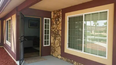 a front door of a home with a window at Cozy 3-bedroom residential home in Wildomar, CA in Wildomar