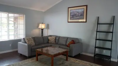 a living room with a couch and a table at Cozy 3-bedroom residential home in Wildomar, CA in Wildomar