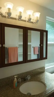 a bathroom sink with a medicine cabinet and a mirror at Cozy 3-bedroom residential home in Wildomar, CA in Wildomar