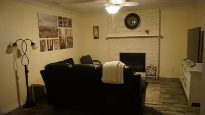 a living room with a couch and a fireplace at Terrific 3-bedroom house with AC in Oceanside in Oceanside