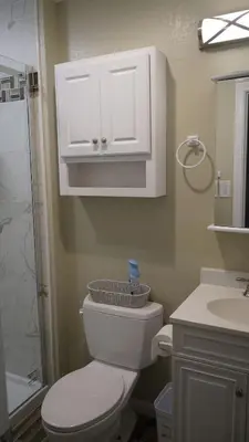 a bathroom with a toilet and a shower and a sink at Terrific 3-bedroom house with AC in Oceanside in Oceanside