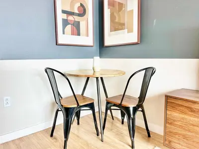 a table and two chairs in a room at Urban Oasis w Rooftop Views Heart of San Diego in San Diego