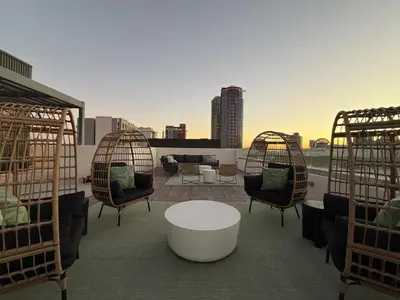 a balcony with chairs and a table on a roof at Urban Oasis w Rooftop Views Heart of San Diego in San Diego