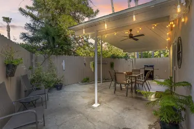 a pavilion with a table and chairs and a ceiling fan at Hideaway ALL Walk to the Beach Downtown AC in San Clemente