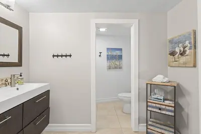a bathroom with a sink and a toilet at Hideaway ALL Walk to the Beach Downtown AC in San Clemente