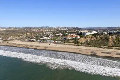 an aerial view of a beach and the ocean at Coastal Duo Steps to Wedding Venues Beach Ole Hanson Casino in San Clemente