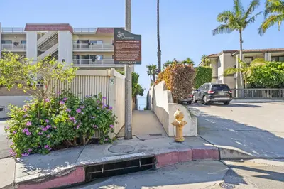 a yellow fire hydrant on the side of a street at Hideaway B Walk to the beach Downtown AC in San Clemente