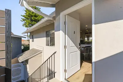 an open door to a house with a porch at Hideaway B Walk to the beach Downtown AC in San Clemente