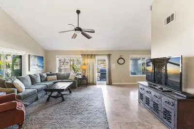 a living room with a couch and a flat screen tv at Coastal Duo Steps to Ole Hanson Casino and the beach in San Clemente