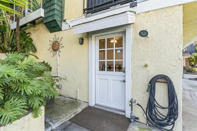 a front door of a house with a hose at Coastal Duo Steps to Ole Hanson Casino and the beach in San Clemente