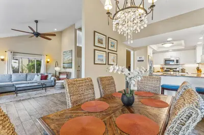 a dining room and living room with a table and chairs at Walk to the beach and Ole Hanson Casino Wedding Venues in San Clemente