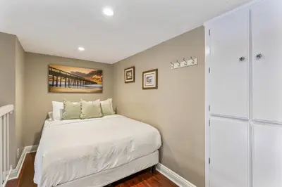 a small bedroom with a bed and a closet at Walk to the beach and Ole Hanson Casino Wedding Venues in San Clemente