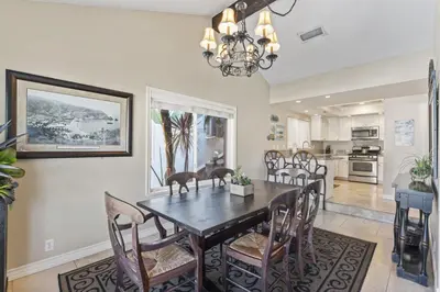 a dining room with a table and chairs at Tropical 2BR Retreat Walk to Beach Wedding Venues Large Deck in San Clemente