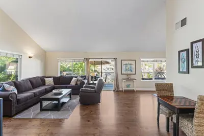 a living room with a couch and a table at Walk to the Beach Wedding Venues Downtown Del Mar AC in San Clemente