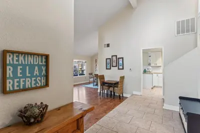 a living room with a table and a dining room at Walk to the Beach Wedding Venues Downtown Del Mar AC in San Clemente