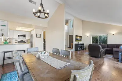 a dining room and living room with a table and chairs at Walk to the Beach Wedding Venues Downtown Del Mar AC in San Clemente