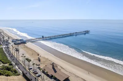 an aerial view of a pier on the beach at Hideaway A Walk to the beach Downtown AC in San Clemente