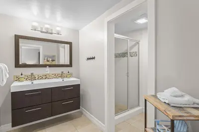 a bathroom with a sink and a shower at Hideaway A Walk to the beach Downtown AC in San Clemente