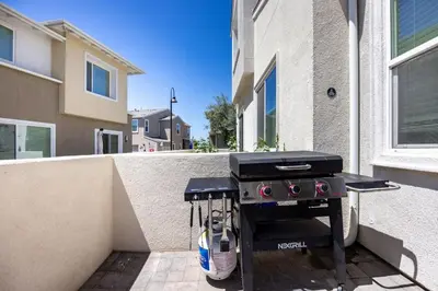a barbecue grill sitting on the side of a building at Chula Vista 3BR with Children's Playroom, Pool, Park and Sleeps 9 in Chula Vista
