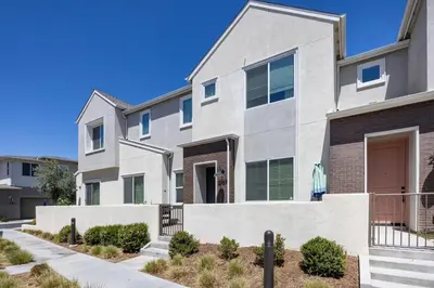 an apartment building with a walkway in front of it at Chula Vista 3BR with Children's Playroom, Pool, Park and Sleeps 9 in Chula Vista