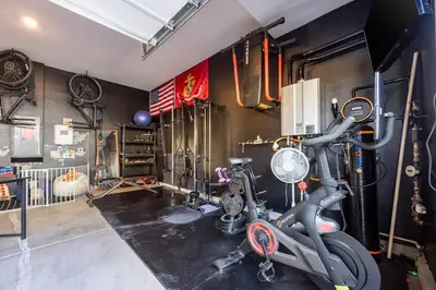 a room with a gym with bikes and exercise equipment at Chula Vista 3BR with Children's Playroom, Pool, Park and Sleeps 9 in Chula Vista