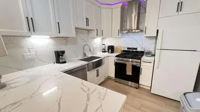 a kitchen with white cabinets and a black and white appliances at 8354 Adam Unit B 1Bed 1Bath by SD Stay in Lemon Grove