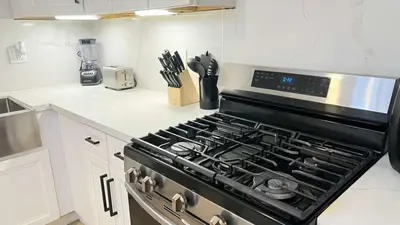 a kitchen with a stove top oven in a kitchen at Gillespie 1059 B 3Bed 2bath by SD Stay in Spring Valley