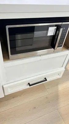 a microwave oven sitting inside of a kitchen drawer at Gillespie 1059 B 3Bed 2bath by SD Stay in Spring Valley