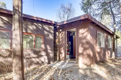 a small house with the door open on the side at MTB Base Camp! Rustic Cabin By Mt Laguna Trails in Mount Laguna