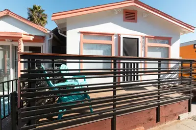 a house with a black fence in front of it at Beach to Bay The Ultimate SD location in San Diego