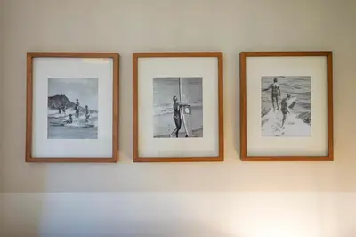three framed pictures of people on a wall at Sunset View home 2 min walk to beach parking in San Diego