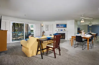 a living room with a couch and a table at 4P-201 Ocean View Steps to Beach in Oceanside