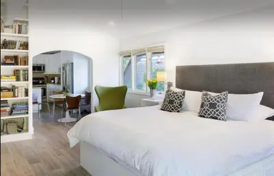 a white bedroom with a large bed and a desk at 2 Bedroom Lux Casita with Resort Amenities in Encinitas