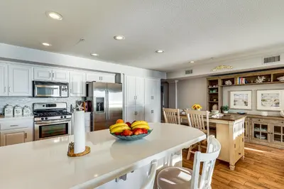 a kitchen with a bowl of fruit on a counter at Spectacular Ocean View! Luxe Condo in San Clemente in San Clemente