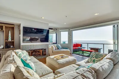 a living room with a view of the ocean at Spectacular Ocean View! Luxe Condo in San Clemente in San Clemente