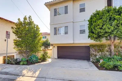 a house with a garage in front of it at Spectacular Ocean View! Luxe Condo in San Clemente in San Clemente